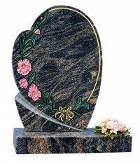 A Himalayan Blue granite memorial with a coloured floral decoration.