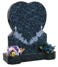 A Blue Pearl heart memorial with carved rose detail.